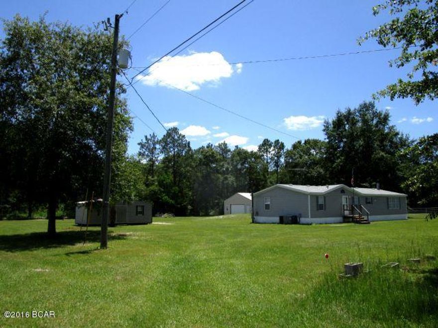 UNBELIEVABLE OPPORTUNITY TO OWN one acre of cleared land that includes the home, a 288 SF storage building and a 1,500 SF garage on a cement slab!  This three bedroom/two bath home has a combined living/dining area, full kitchen and a family room with a fireplace.  From the laundry room, you can exit the back door and it will take you to the spacious detached garage with a full size garage door and separate entry.  All electric, this garage has separate rooms that could be used as an office or more specific storage areas.  And, that additional storage building offers even more storage for the family!   Located on a small private road, the lot is partially fenced and beautifully maintained.  If you need a place to both live and work, this is it!