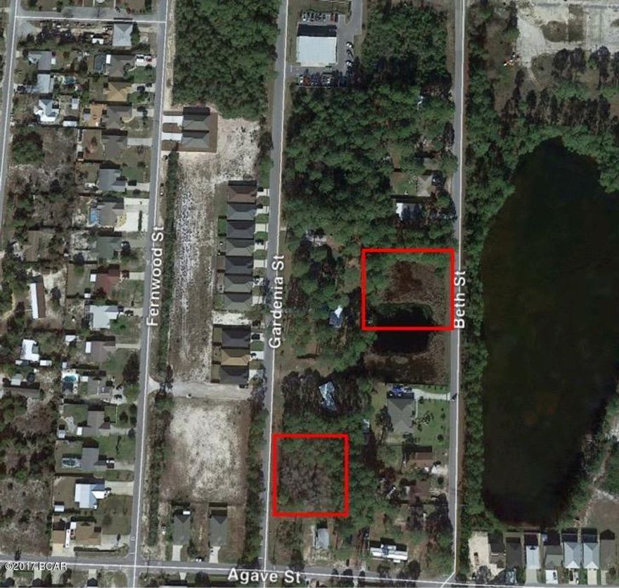 Listing includes large lot on Gardenia Street(4 lots)as well as lot on the west side of Beth that includes 1/2 of the pond. See photos and property appraisers site for details. Great location with possibility of building one or more homes. Buyer to conduct own due diligence as to what can be built on the property.
