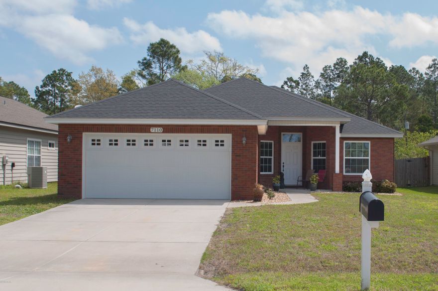 Beautiful 4 year old home that has been very well maintained.  Brick front with vinyl sides with 4 bedrooms, 2 baths and a very large kitchen.  The living room boasts 10 foot ceilings with fan and recessed lighting.  A set of French doors with built-in mini blinds opens onto the covered porch and spacious privacy fenced back yard.  The kitchen has loads of workspace, all wood maple cabinets, granite look countertops and breakfast bar, stainless steel appliances and large pantry.  Utility room conveniently located close to 3 bedrooms that share the hall bath.  The master is on the opposite side of the house and offers 9 foot boxed ceiling with ceiling fan, large walk in closet and dual vanities in the bath.  Home is equipped with the NEST system with visual doorbell, thermostat, sprinkler.