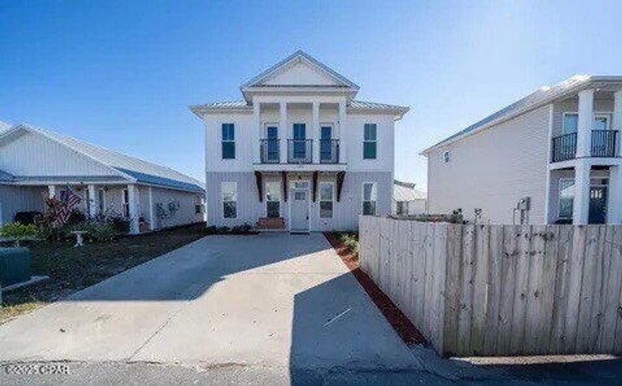 This two-story Craftsman-style residence is equipped with a solar panel system, providing significant savings on energy costs. The home offers two expansive living areas, featuring a bonus room on the upper level and a traditional living room on the main floor. The kitchen is elegantly designed with quartz countertops, custom cabinetry, a pantry, and stainless steel appliances. Distinctive lighting fixtures are thoughtfully integrated throughout the home. The property is situated in a neighborhood that includes a playground and is conveniently located just minutes from Tyndall Air Force Base, Eastern Shipbuilding, as well as a variety of shops and restaurants. Please text a photo of your driver's license to our office number ending in 1673, along with the name of the property that you are interested in and we will schedule your showing within 1 business day.  We apologize for being cryptic about our phone number, it is likely on the web page you are viewing, but our MLS rules make this procedure LESS THAN 'user-friendly'.