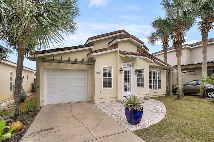 .IMPECAcBLEY MAINTAINED! This open concept Mediterranean cottage has almost everything replaced.  Rental restricted community. Close to shopping and lots of convenience but when you want to come home to peach and quiet this is it! Beautifully paved brick patios in front and back.  Garden setting where blue birds nest and the fragrance of the orange tree will settle any daily stress.  Sunsetter awning  with remote control and wind sensor hood for protection.  Hurricane shutters, washer and dryer replaced in 2015, microwave in 2016, air condition and compressor new in 2018.  All closets with shelves makes storage. Interior totally repainted in 2015, brand new sod.  Plantation shutters at the windows.  All measurements believed accurate but should be verified if important to purchaser.