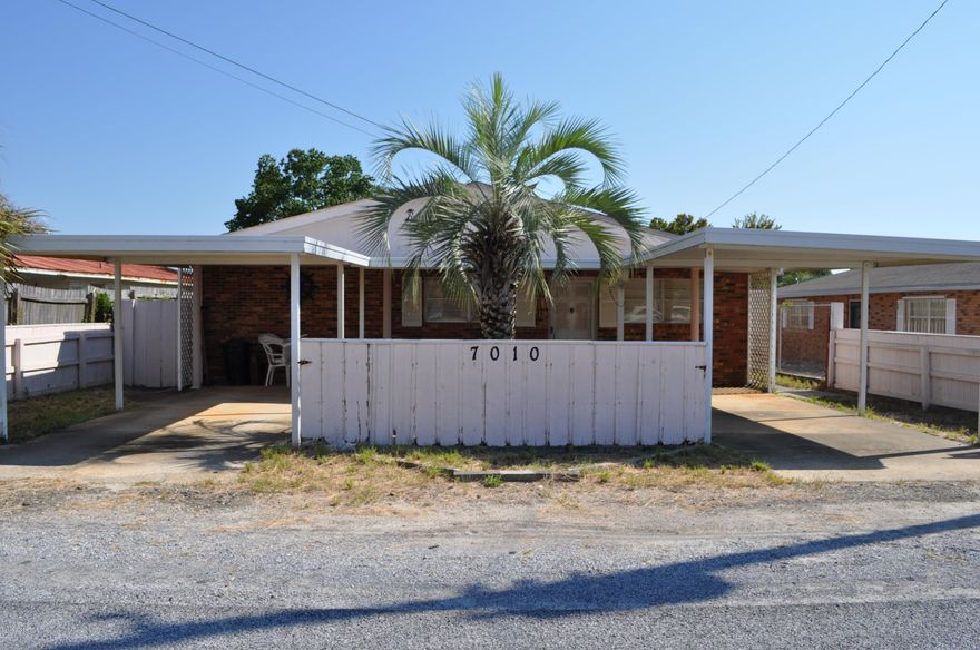 Close to the beach!  This is a 2BR/1BA cottage with extra inside storage, covered parking for two cars and a fenced backyard.  Home needs a little updating, but would be the perfect respite for any family or a good rental investment.  You're walking distance to the beach and only a 5 minutes drive to St. Andrews State Park, many restaurants, and family friendly attractions.  All info is approx. and must be verified by Buyers if important.