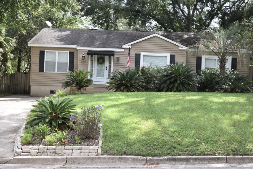 Beautifully renovated and desirable home in the Cove.  Updates include roof, hardwood and tile flooring, gourmet kitchen with stainless appliances, custom cabinets, granite countertops, island, breakfast area, wine bar, separate formal dining room, laundry room with large pantry, covered porch and deck. If that isn't enough, the completely fenced in backyard includes a detached garage and a storage shed.