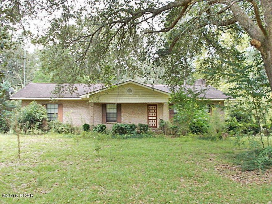 Brick home on a corner not with over 4 ac in the country but on a paved road, large open living/dining area with a very large brick fireplace, breakfast bar, large master bedroom with master bath, 2 car carport built on the back of the house that could me made into additional living space, chain link fencing, large workshop in back, concrete floors,block walls,slab foundation, elect, water,sliding doors lead to an open workshop, there is also another open shop farther back on the property, all very private, call agent today to view this home, very easy to show. This home was appraised in 2014 and is selling under appraised value.