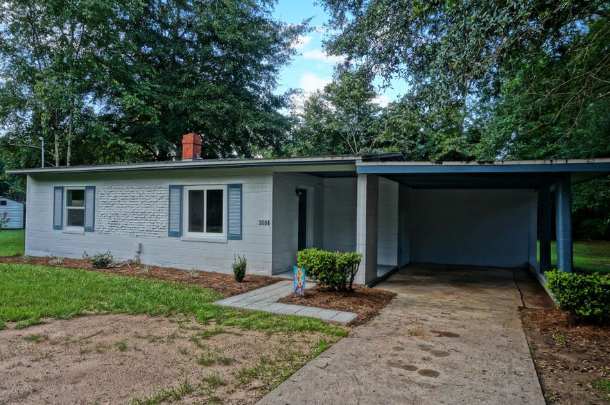 STOP THE CAR..A walkable neighborhood and meticulously renovated. This is a deal and adorable! New carpet, new windows, vinyl wood plank flooring, new fixtures and new appliances. You will want to spend time outside on the screened porch enjoying the spacious yard and may even want to start a home garden.