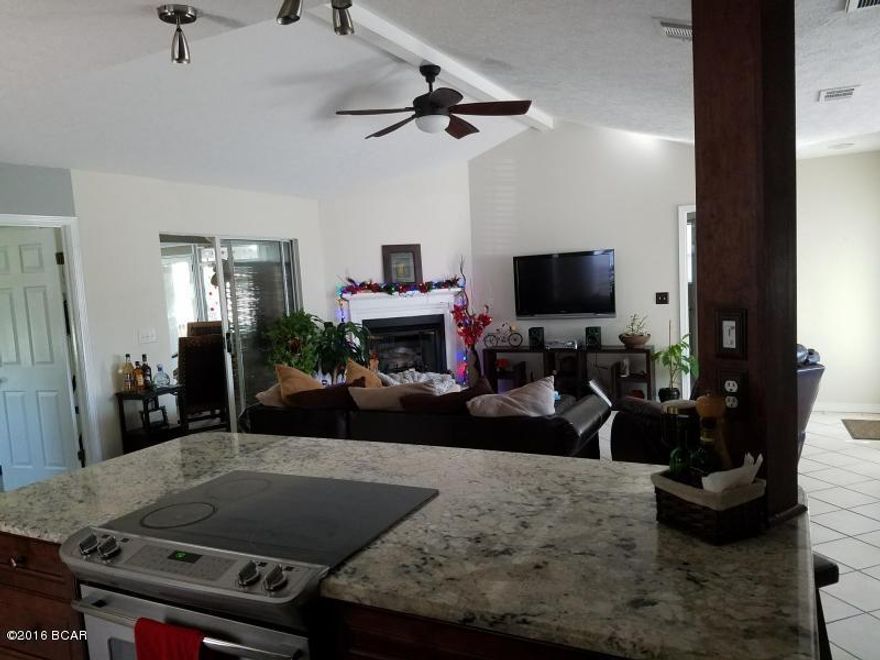 Charming home in a quaint neighborhood . Split bedroom plan with cathedral ceilings in a Great room and Master bedroom; gas fireplace in Great room; large tiled Florida room; Kitchen with Breakfast room; separate dining area;  all on a large lot. Convenient to schools, beaches, and Navy base. Kitchen remodeled with top of the line stainless steel appliances and granite counter tops in 2014. New A/C and patio build  in 2016. Sold unfurnished but that is negotiable. All measurements are approx. and must be verified by buyers if important.