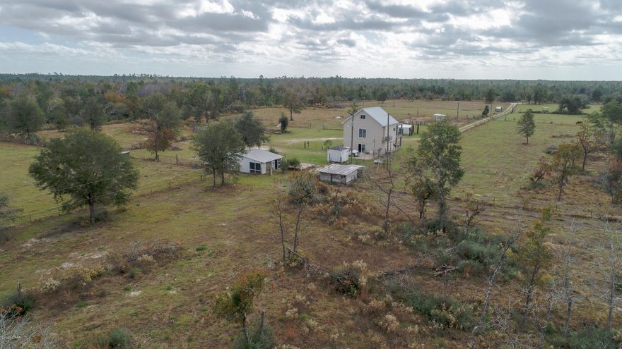 CURRENTLY UNDER CONTRACT, SELLER ACCEPTING BACKUP OFFERS-Showing by appointment only. Locked entrance gate with guard dogs on premises. 20 Acres of farm, cattle grazing land.  Be self sufficient with this country charm on dry grassy cleared land. Entire 20 acres fenced with multiple corrals/paddocks and cattle gates between separate fenced areas. Electric power distributed through the 20 acres. 2 deep wells redundantly plumbed with water run throughout the 20 acres. 2 Goat barns, a Chicken coup, Pig pen and multiple grass gazing fenced areas for Horses, goats or livestock of your choice. 1 Bedroom, 1 Bath, 3 story house with detached workshop/barn.

Also enough land for a garden, and space for a mobile home. Four power poles, three currently active, multiple night lights on property. This