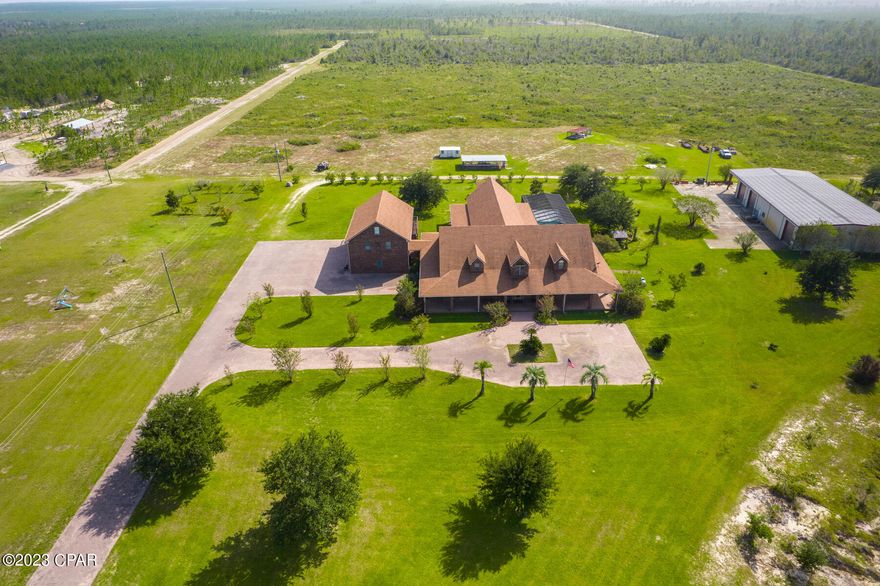 Your Exquisite Retreat Awaits at 495 SR 20 in Youngstown, Florida!

Prepare to be captivated by this exceptional estate, boasting over 10,000 square feet of luxurious living space, a detached 4-car garage with a two-story apartment, and a plethora of amenities on a sprawling 65 acre parcel.

Property Features:
-Over 10,000 sq. ft. of Elegant Living
-Detached 4 -Car Garage with 2 Story Apartment
-Chefs Dream Kitchen with Custom Cabinets and Design
-3 Wells and 3 Septic Tanks for Ultimate Convenience
-Office with Custom Built-in Gun Cases and Shelves
-Expansive Hunting Land Right at Your Doorstep
-Workshop with 3 Roll up Doors/ Shower/Bathroom and Office
-1.2 Acre Fish-Stocked Pond for Angler's delight
-65 Acres of Serene Lush Landscapes
-Sparkling Screened-In Salt Water Pool 
-Steam Room
-Relaxing Sauna
-Inviting Hot Tub
and so much more!

This extraordinary estate will leave you in awe, from its grand entrance to the serene property beyond. The chef's kitchen is a culinary masterpiece, featuring custom cabinets, wine cooler, 2 dishwashers and top-of-the-line appliances, perfect for the culinary enthusiast. 

Prepare to be impressed by the expansive walk-in closets that accompany each bedroom. These walk-in closets are a fashion enthusiasts dream, providing plenty of room for your wardrobe, accessories, and more! Organization has never been this luxurious.
This property also boasts a sprawling office space, perfect for those who appreciate both work and leisure. The office includes custom-built gun cases and cabinets, showcasing your collection in elegant and secure manner. Whether you're a collector or a professional in need of ample workspace, this office has you covered.

Immerse yourself in luxury with this stunning listing featuring 6 spacious bathrooms, each adorned with indulgent walk-in showers. Wrap yourself in warm towels from the built-in heated towel racks. Your daily routine will transform into a spa-like experience especially in the Master Bath that has a beautiful whirlpool jacuzzi tub!

The detached 4-car garage comes with a 2-story apartment, ideal for guests or as an income generating rental space. With multiple septic's and wells, this property is designed for maximum convenience and flexibility. Both the main house and apartment have spacious balconies for you to enjoy breathtaking views. 

Outdoor enthusiast will revel in the expansive hunting land, while hobbyists or entrepreneurs will appreciate the spacious workshop for endless possibilities.  

Nature lovers will adore the 1.2 acre fish-stocked pond and 65 acres of land to explore, providing tranquil escape from the everyday hustle and bustle. Wake up to a beautiful scene of Wildlife right out your back door.

Unwind and rejuvenate in the sparkling salt water pool, sauna, steam room and hot tub, making everyday feel like a vacation in Paradise. Take a short 45 minute drive to the ''World's Most Beautiful Beaches'' on Panama City Beach, FL! Or, Drive a few miles away to the crystal clear lakes and springs nearby!

Additionally, this property boost 4 brand new Rinnai Tankless Water Heaters, 3 New AC units, fruit trees, chicken pen, dog cages and so much more! This exceptional estate is more than just a property, it's a lifestyle. Whether you're seeking a tranquil retreat or a place to build your dream life, 495 SR 20 in Youngstown, Florida, offers a world of possibilities. Don't miss out on this exceptional opportunity to shape your future in this serene setting. 

Call your agent today and schedule your private tour of this stunning property!

Highly Motivated Seller!!