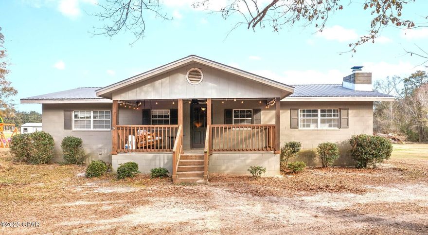 Escape to the country with this stunning home nestled on 2+/- acres, offering the perfect blend of charm and comfort! Step inside to find 4 spacious bedrooms, each featuring its own ensuite bathroom, ensuring ultimate privacy for family and guests. Enjoy both a formal living room and a cozy family room with a wood-burning fireplace, ideal for relaxing or entertaining. The thoughtfully designed kitchen is complete with stainless steel appliances, a breakfast bar, and an abundance of cabinetry for all your storage needs. Outside, you'll find covered front and back porches, storage shed, and an in-ground swimming pool offering convenient access from one of the bedrooms. Property is situated between Chipley and Graceville, a short drive to Hwy 231.