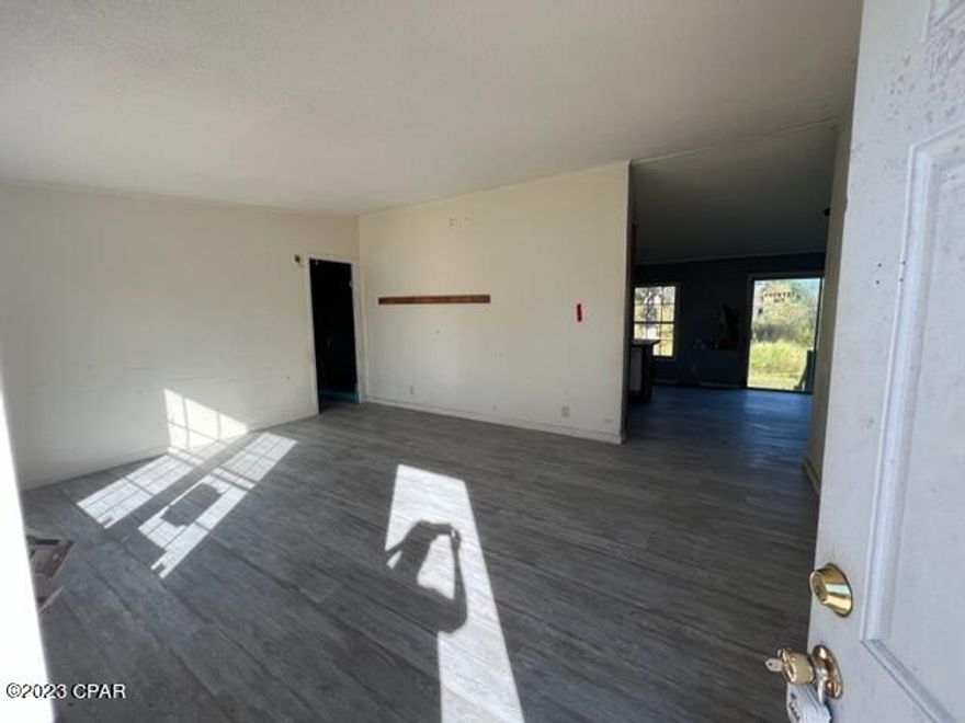 Centrally located, close to shopping, restaurants, schools and TAFB, yet quiet and private at the end of the road, no thru traffic.  This home sits on approx 1.21 Acres.  It is a 2002 model, 3 bedroom, 2 bath, split floorplan. So with some vision and determination, this could be a great home (and the neighbors seem really nice!).  Owner Occupants ONLY until 2/29/24.  *All info is approx and buyer to verify/inspect, etc any info that is important.