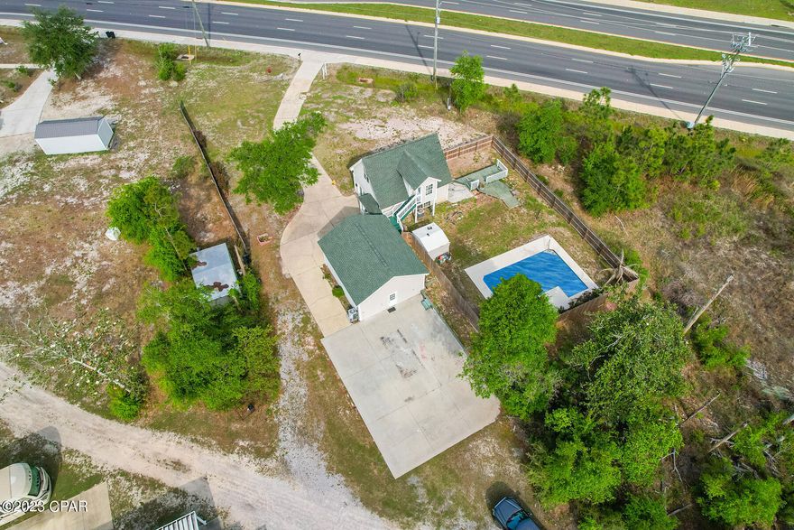 Offered for sale is a very unique property. this commercial property located on highway 390 sees about 25,000 cars each day. The FDOT says That number is set to increase once the expansion of 390 is complete. In Its current set up this property includes a 450 Sqft Studio apartment, a 480 sqft office space ( could be converted into another apartment), an operational in-ground pool, and a 600 sqft climate controlled work shop. centrally located in Panama City, you will enjoy being a straight shot to lynn haven, and 23rd street. Sitting on a 0.5 acre commercial lot this property is set up to facilitate a multitude of businesses and with its approximately 115 feet of frontage on highway 390 your patrons will enjoy easy ingress and egress.