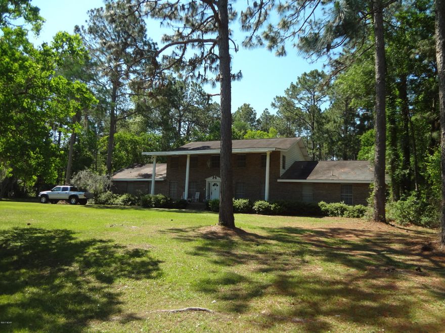 Expansive all brick home in College Point, Lynn Haven, situated on over 1.5 acre parcel with small pond.

Home is in need of repairs and updating.

  This is a great piece of property along a stately home that is just waiting to return to it's former glory.

Call for details.
