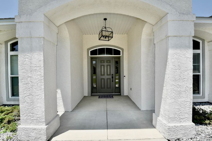 Back on the market due to financing. This beautiful 4 BR 2 BA home sits on a large lot, only minutes to Tyndall AFB with beaches, shopping, restaurants, boat launches, and less than 30 minutes to Mexico Beach!  The home offers 2006 sqft with a great split floor plan and open concept.  Crown molding in living room, dining, kitchen, and hallway.  The kitchen features custom two-tone cabinets, quartz counter tops, stainless steel appliances, a large island with undermount sink, a breakfast area, and French doors leading to the screened-in back patio.  The living room and dining area are very spacious making this open floor plan ideal for entertaining.  The Master bedroom has a tray ceiling and an oversized en-suite with a gorgeous tiled walk-in shower, soaker tub, dual vanity, separate water closet, and a nice size walk in closet.  There are 2 bedrooms and a full bathroom on one side of the home and a bonus room on the other side, next to the Master bedroom.  The fourth bedroom is on the second floor.  The large backyard includes a 12 ' x 10' storage building and is enclosed by a wooden privacy fence, providing safety and security for your children and pets.  It has plenty of space to store your boat, RV, and other toys.  No HOA and this home is not in a flood zone.  Call for your private tour today.  Measurements approx; verify if important.