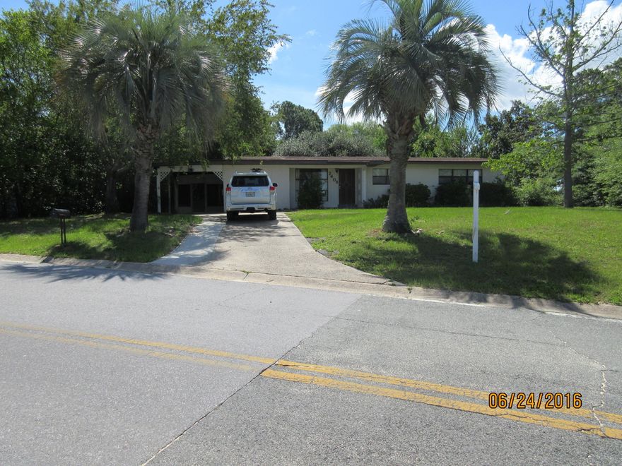 Centrally located, corner lot, tile flooring in living areas, carpet in bedrooms, laundry room, bonus room/den, large screened back porch, carport, all electric appliances - dishwasher, stove/oven, refrigerator, washer & dryer, central heat & air, city water/septic system.  Pet is negotiable