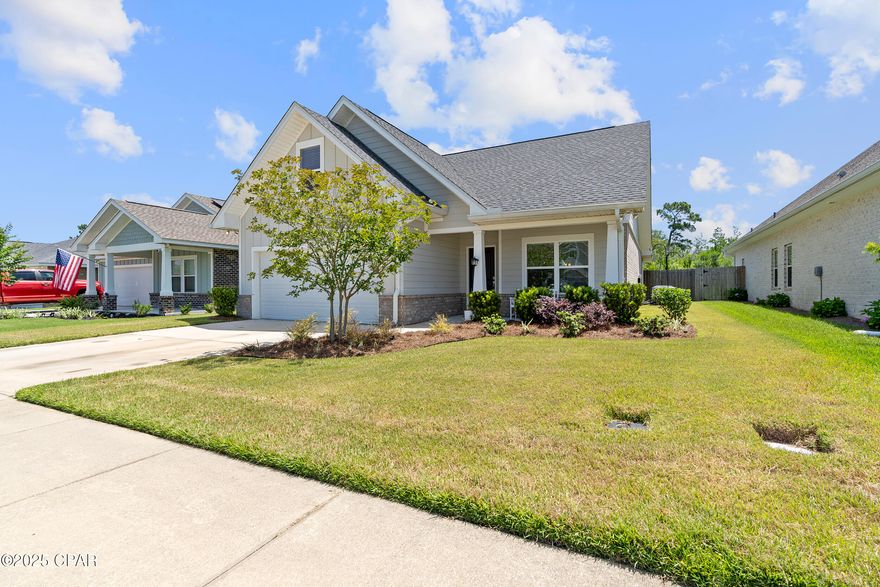 Beautiful well kept 4BR/3BA home in Camryn's Crossing II in Lynn Haven! Built by Southern Coastal Homes, this well-maintained property features an open-concept floor plan with a spacious great room and tray ceiling, a gourmet kitchen with center island, custom cabinets, and stainless steel appliances. Dining area flows from kitchen; separate laundry room adds convenience. The primary suite offers a tray ceiling, double vanity, garden tub, and walk-in closet. Bonus 4th BR/loft with full bath upstairs - perfect for guests or home office. Enjoy outdoor living with a covered lanai, front porch, fully fenced yard, and Rain Bird irrigation. 2-car garage. Move-in ready!