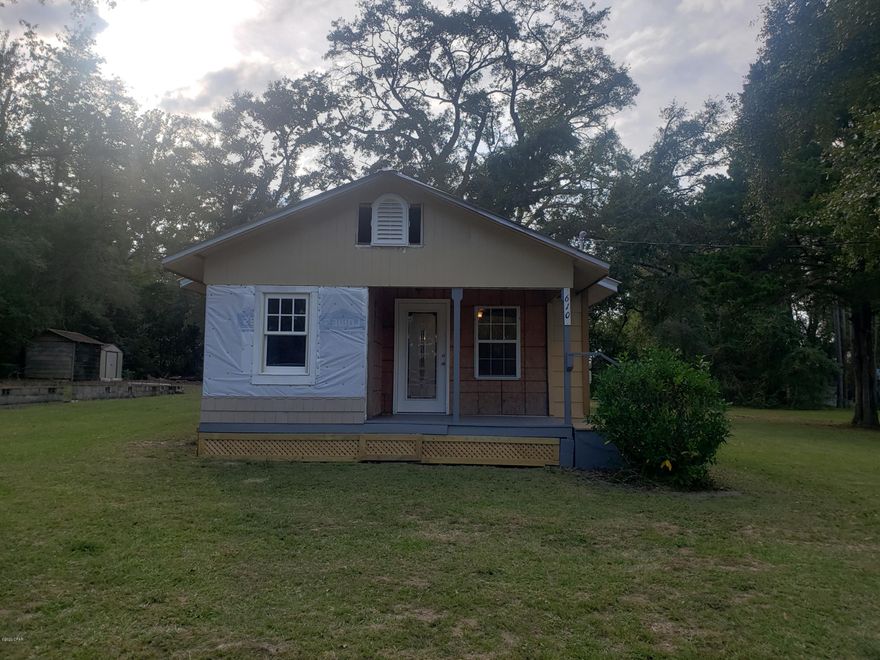 CURRENTLY UNDER CONTRACT, SELLER ACCEPTING BACKUP OFFERS. Cozy fixer upper in Chipley city limits. Home has had some updates but now its your turn to finish it.  Open kitchen/dining/living area, bedroom with walk in closet at the front of the home and an additional bedroom and laundry area at the rear. Full bath with corner shower. Window ac/heat. Metal roof. Home sits on a spacious lot, .49 acre MOL. There are a couple of outbuildings for storage. Owner has left some materials with the home. Close to the amenities of city living, shopping, post office, banking and restaurants. Lots of potential for a family home or investment property.