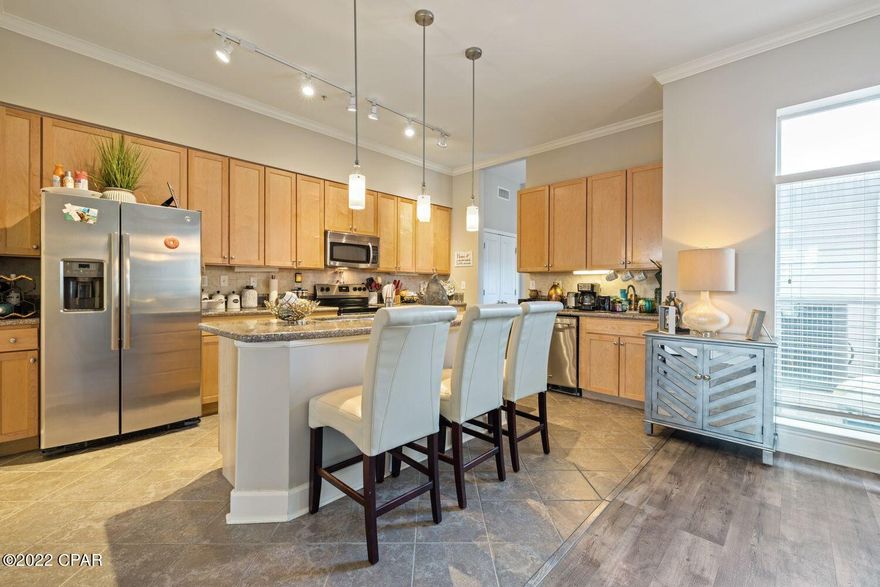 Great Opportunity to purchase a rare executive Penthouse unit in the Exclusive Gated Island Reserve.  There are only 12 of these large units out of 300 and rare to go on the market.  This unit is close to 2600 square feet with 3 bedrooms and 3.5 bath.  Two masters with all bedrooms having a full bath and large walk in closets.  Large upgraded kitchen with open floor plan, granite counters, new stainless steel appliances and a wet bar with wine cooler and ice maker.  Computer office area next to laundry room. Crown molding throughout with raised ceilings. Balcony off the master bedroom. New gray plank wood flooring and  new carpet being installed on staircases.  Large oversize 2 car garage.  Unit is close to front gate, clubhouse and pool.  HOA covers all repairs, utilities (except electricity/wifi), insurance, roof, landscaping etc. Only condo complex in PC Beach with an indoor basketball court, large pool with waterfalls, state of the art fitness club. If you have childrent, they 
will love the exotic pool, clubhouse etc. Two entry gates located on Middle Beach and near Back Beach.  Great opportunity to purchase this large unit and minutes from the beach, shopping, restaurants.