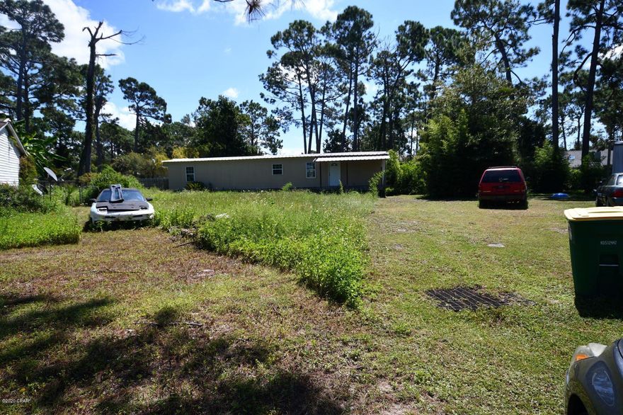 2 bedroom 1 bath mobile home on a nice and quiet cul-de-sac close to the water in Panama City! The house will need a lot of work but currently has  a 3-yr old roof,  and some other renovations that were never finished. Including but not limited to the kitchen, the bathroom, an additional bathroom, and a laundry room.