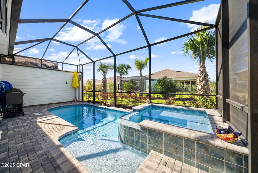 Motivated Sellers! This villa has so many upgrades done during and after the build process! Close to $30K in upgrades after the build, seller's loss and your gain! This won't last at this price! 

Come Live the Latitude Lifestyle. Imagine yourself enjoying your own private pool/spa/hot-tub. Year round enjoyment! Latitude Margaritaville Watersound is a Active 55+ community perch along the Intracoastal Waterway, just 7 miles from the Gulf waters of Florida's Emerald Coast! Coastal living at its finest! 

Exquisitely Upgraded Tortola with private pool, hot tub/spa!

Experience unmatched coastal living in this highly upgraded 2 bedroom/2.5 bath  Tortola Villa, showcasing a private pool and hot tub, premium designer finishes, and a bright, open concept layout that effortlessly blends luxury and low-maintenance living.

The chef's kitchen is beautifully appointed with a gas range, level 4 cabinetry, level 3 quartz countertops and a spacious island for gathering. Revwood by Mohawk laminate flooring extends throughout the home- no carpet- providing both durability and style. 

The open concept great room is filled with natural light, showcasing a custom wall unit with shelving and an elegant electric fireplace feature, an impressive focal point. A full wall of glass sliders opens to the outdoor oasis, seamlessly expanding the living space. The adjacent dining area comfortably accommodates gatherings of any size.

Step outside to your private retreat on the extended screened lanai, showcasing  a sparkling private pool and hot tub, paver surround and privacy screens. 

The primary en-suite offers a serene escape with a spa-inspired fully tiled shower with frameless enclosure, upgraded cabinetry, quartz countertops, and a custom-designed walk-in closet. The secondary en-suite bedroom includes its own full tile bath and linen cabinet and custom closet built-ins. 

A versatile flex space is ideal for an office, media room, or additional guest accommodations and is conveniently located beside a half bath.

Additional features include a 2 car garage with built-in storage cabinetry, overhead storage, attic with pull-down stairs and a unique ceiling-mounted pulley system, maximizing floor space and functionality. Generator ready electrical plug in the garage, Hurricane IMPACT WINDOWS (a costly upgrade) & garage door, remote electronic shades on sliders, entire interior painted post-closing with Sherwin-Williams eggshell finish. 

This highly upgraded Tortola is move-in ready and located in one of the most sought-after 55+ coastal lifestyle communities--just minutes from world-class amenities which include; Expansive Fins Up! Fitness Center with state-of-the-art equipment, Resort-style lagoon pool with private cabanas, Indoor pool and dedicated lap lanes, Bar & Chill Restaurant and Changes in Attitude Bar overlooking the Intracoastal Waterway, Tennis, pickleball, and bocce courts, miles of walking, biking, and golf-cart trails throughout the community. Dog park, green spaces, and community gathering areas. Ceramic shop, wood-working shop, theater, meeting rooms, and multipurpose event spaces. Full calendar of events including special interest clubs, concerts, fitness classes, and social gatherings year round. 

Adjacent commercial conveniences include- shopping, dining, banking and a future Publix grocery store. Future Marina adjacent to the amenities center off of Latitude Blvd. A new medical center opened is open now with a new state of the art hospital opening in 2027 just 5 miles away. Best of all - the BEACH is just 7 miles from your front door! 

Don't miss this opportunity for a highly upgraded Villa. Sought after picturesque phase 8 location! 

Discover the unmatched lifestyle of Latitude Margaritaville Watersound- where everyday feels like a vacation!