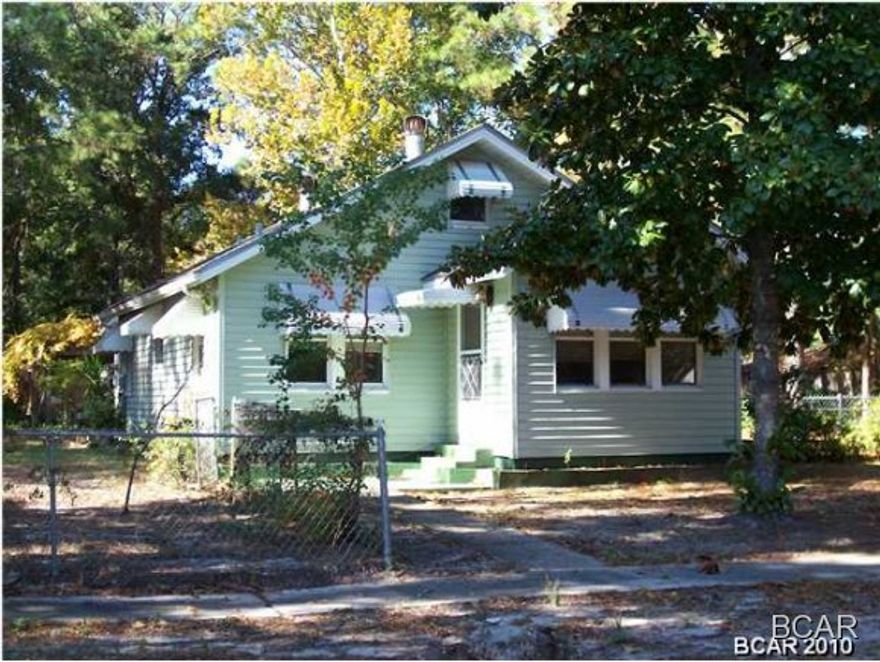 Cove home located just a few blocks from the hospital, and just a few more from down town and the court house. This is a 2 bedroom, 1.5 bath home sitting on two lots with a fenced yard.  Kitchen recently updated.