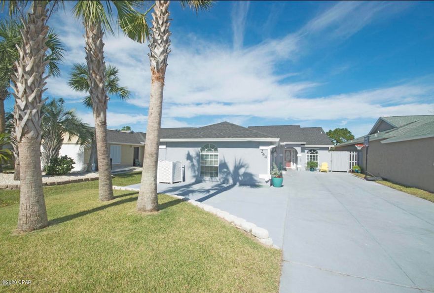 CURRENTLY UNDER CONTRACT, SELLER ACCEPTING BACKUP OFFERS - Updated home located in the Glades neighborhood which is minutes from the beach and is golf cart friendly with access on Hutchison Blvd and PCB PKWY. There are many updates throughout the home such as wood floors, roof, gutters, interior and exterior paint and an extended driveway. The master bedroom has decorative flooring, chandelier lighting, dressing area and oversized bathroom.  The pool is an inground and saltwater for easy maintenance. The backyard has pavers, extra lighting, firepit and perfect for entertaining guests or just a quiet night with a fire and a book after watching the sunset. Walk or Golf Cart to multiple restaurants, shopping and the beach. Come see today!