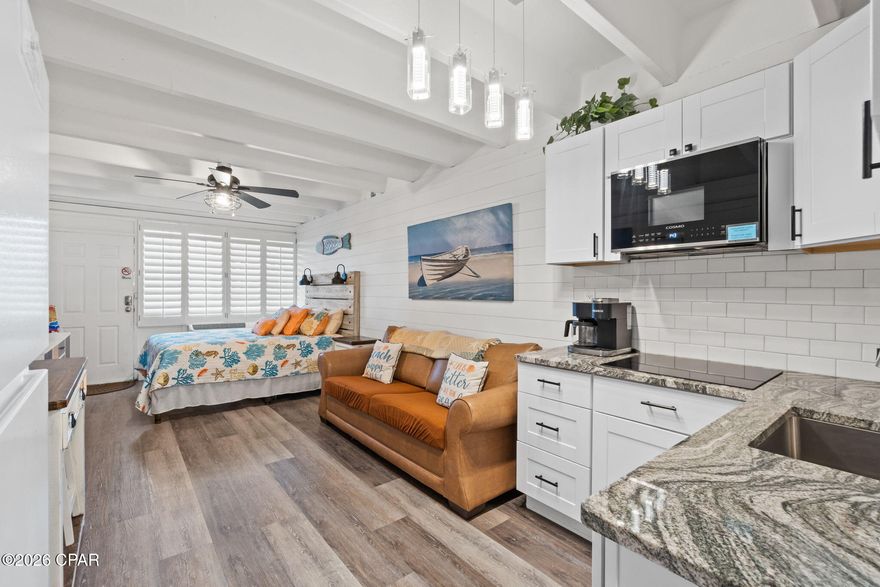 Take a peek at this coastal cutie! 🌊☀️

Welcome to a meticulously maintained condominium co-op community where short-term rentals are allowed -- and where Unit 401 has been part of one family's cherished traditions and happy memories for over 25 years. Now, it's ready for the next chapter and a new set of unforgettable beachside moments.

Fontainebleau Terrace, built right on Panama City Beach in 1965, has truly stood the test of time -- and then some. Thanks to incredible pride of ownership and attentive association management, the building and its amenities are beautifully maintained and up to date. Not only does she have a pretty face, Fontainebleau Terrace has successfully passed all inspections, with no new assessments on the horizon -- a huge plus!

This Gulf-front community offers everything you need for relaxed coastal living: Owner's lounge, Game room, Fitness room, Laundry facilities, A gorgeous partially covered pool, Open-air and covered gathering spaces overlooking the beach and Gulf, Elevator access to all floors, All utilities included in dues even ELECTRICITY!
And beach service is being added this year! 🏖️

Perfectly positioned next to a dedicated beach, you'll enjoy unobstructed views of sugar-white sand, sea oats, and emerald-green waters in a low-density setting. Plus, you're just a short drive from dining, shopping, and entertainment in Panama City Beach, 30A, St. Andrews, and downtown Panama City.

Now let's step inside Unit 401... ✨

You'll find a beautifully updated space featuring: Shiplap walls, Plantation shutters, Gorgeous LVP flooring, Granite kitchen countertops, White subway tile backsplash, Shaker cabinets, Stainless farm-style sink,
Microwave, cooktop, and refrigerator, 
A stylish decorative barn door separates the kitchen and bath, where you'll find a bright, fresh space with a new vanity, porcelain sink, and a shower/tub combo, all accented with updated fixtures.

Turn-key and ready to go, whether you're looking for a primary residence, second home, or a vacation rental investment.