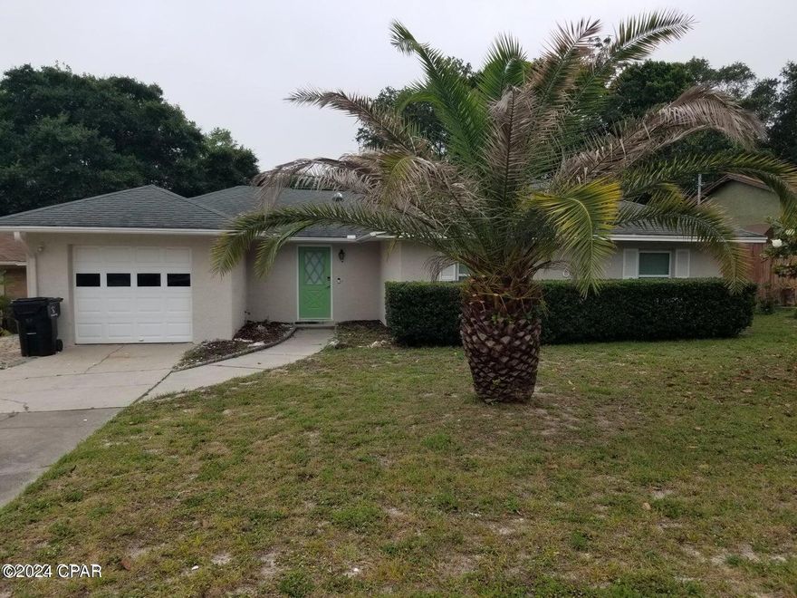 Move-in Special 500.00 first month rent. Walk to the beach Panama City Beach Located in the desirable Lullwater area, you can enjoy living in this 3 bedroom 2 bath single family home with garage. Large open floor plan with living room, dining room and a large kitchen with a bar stool area and window over the sink. The large and spacious bedrooms will accommodate all your furniture. Private fenced back yard for all your outdoor activities and close to Pier Park and everything.