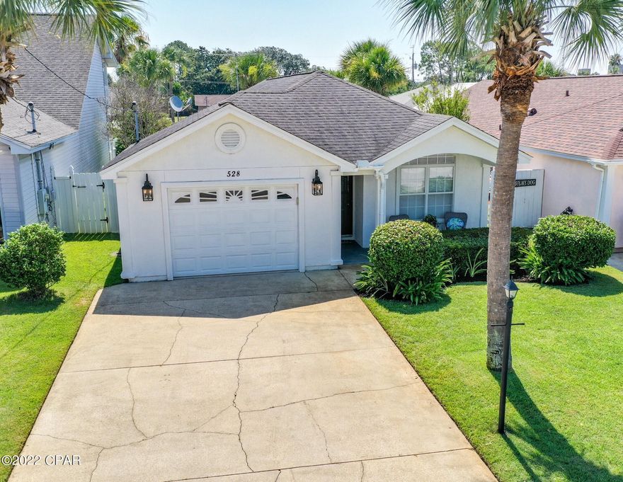 'CURRENTLY UNDER CONTRACT, SELLER WILL CONSIDER BACKUP OFFERS' Reward yourself with this well maintained, 3 bedroom, 2 full bathroom beach home. Located approximately 400 yards from the nearest beach access and convenient to shopping, world class dining and entertainment. This home provides nearly 1,300sq.ft of comfortable living space perfect for entertaining family and guests. The open kitchen with a spacious breakfast bar opens up to the dining room and great room. Highlights include tile floors throughout the main living areas, crown molding, a garage, a well for the irrigation system, a large screened patio and plenty of green space. The abundance of windows and high ceilings allow natural light to flow throughout the home's open airy layout. The master bedroom flows into the master bath that offers a double vanity, tiled floors and a walk in closet. You'll find the other two bedrooms provide plenty of additional space for guest sleep and/or study. This home is the perfect beach getaway or forever home! Call us for more information or to schedule a private showing.