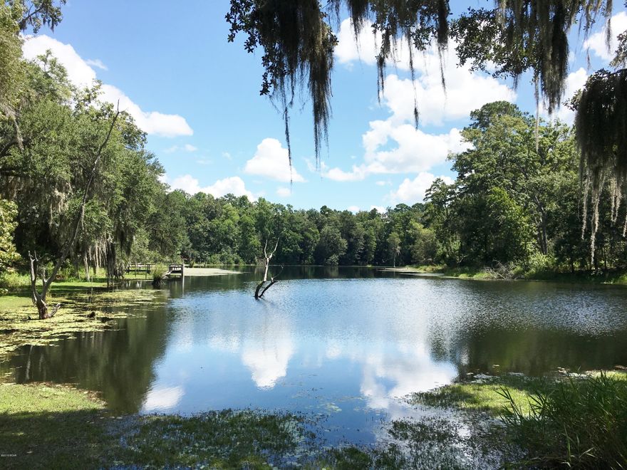 126 ACRES of PARADISE! PEACEFUL AND PRIVATE! BEAUTIFUL SPRING FED LAKE CALLED “HIDDEN HOLLOW LAKE”, THE FLOW FROM THIS LAKE, THE LOCAL RAINS AND THE HIGH ELEVATIONS SURROUNDING FORMS ANOTHER BEAUTIFUL POND BOTH FULL OF FISH. THE PROPERTY HAS ELEVATIONS FROM THE LAKES UP TO 200 FT, BEAUTIFUL HILLTOP VIEWS, ROMANTIC SUNSETS AND NUMEROUS GORGEOUS HOMESITES. IF YOU ENJOY THE OUTDOORS AND WILDLIFE THIS PROPERTY IS FULL OF DEER, DUCKS, TURKEY, BIRDS OF MANY TYPES AND NO TELLING WHAT ELSE! CURRENTLY THE PROPERTY IS USED AS A PRIVATE RETREAT AND WILDLIFE REFUGE.THERE ARE 41 ACRES OF MANAGED, MATURE SLASH PINES, APPROXIMATELY 50 ACRES IN WELL ESTABLISHED PASTURE THAT HAS BEEN KNOWN TO RUN 1 -1 1/2 COW TO THE ACRE AND PRODUCE SOME GREAT HAY, SCATTERED AROUND THE PASTURE ARE NUMEROUS MATURE PECAN TREES, THE BLANCE OF THE PROPERTY IS IN THE LAKES, 1 CYPRESS POND, HIGH RIDGES AND HARDWOODS.  NOW FOR THE ICING ON THE CAKE!   BUILT IN 2010 IS A MORTON METAL BUILDING THAT IS 36 X 40 PLUS A 15 X 36 LOFT, PLUMBING, RANII ON-DEMAND HOT WATER, SEPTIC, WELL, PORCHES, DOUBLE PANE WINDOWS, SPRAY FOAM INSULATION AND PARTIALLY FINISHED KITCHEN. THE FULLY INSULATED MORTON BUILDING COULD BE FINISHED OUT AS A BEAUTIFUL RESIDENCE, MANCAVE, SHOP, HORSE BARN OR YOUR CHOICE OF USE.  THE ELECTRICITY IS ALL UNDERGROUND TO THE MORTON BUILDING AND THERE ARE ALSO A COUPLE OF RV POWER HOOKUPS FOR YOUR TRAVELING FREINDS. THERE ALSO IS A SPRINKLER SYSTEM SURROUNDING THE BUILDING. IF YOU ARE LOOKING FOR A BEAUTIFUL RETREAT AND OWNING YOUR OWN LAKE, I DON'T THINK YOU CAN FIND MUCH BETTER IN OUR BEAUTIFUL NORTH FLORIDA PANHANDLE PARADISE.