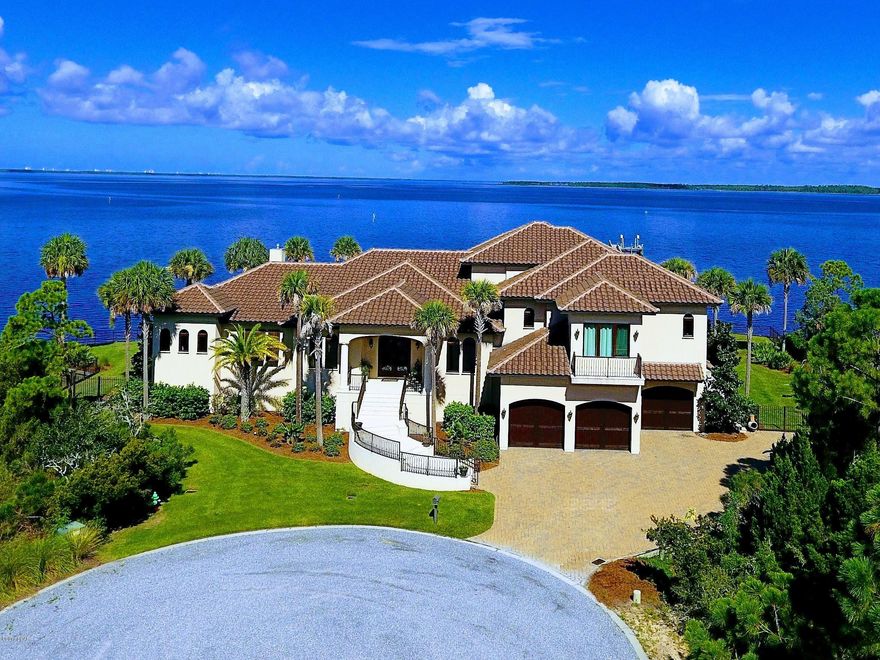Northshore Islands, unbelievable view,  450 feet of waterfront, infinity edge pool w/ heat resistant coral stone deck, Elevator shaft, three car garage, theatre room w/ soundproof walls, exercise room w/ industrial fan, rubber soundproof floors, an office / library, Florida room, formal dining / playroom and double lot! The tailor made kitchen features Saltillo floors, Dacor microwave drawer and warming tray, limestone hood, custom counters. The Master Suite is on the corner overlooking the Bay w/ multiple shower heads in the master bath and massive closet with built-ins. Floor plan makes great sense with five bedrooms and four and half bathrooms with superb flow. Outside, the view will leave one speechless and a feeling of constant vacation. Truly, one of a KIND!