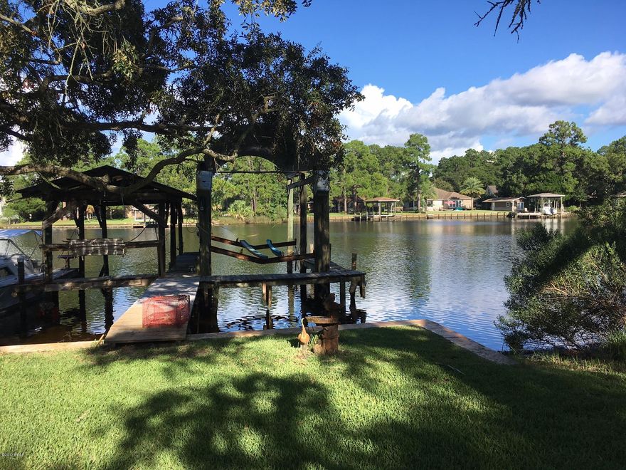 NOW APPROVED WATERFRONT SHORT SALE <> BOAT HOUSE AND LIFT <> DOCK <> GULF ACCESS <> BEAMED CEILING <> LARGE LOT <> LEMON TREE  <> SITTING AREAS <> GAME ROOM <> FLORIDA ROOM <> LARGE KITCHEN <> BREAKFAST BAR <> FRENCH DOORS CONNECTING MASTER BEDROOM TO OUTSIDE PATIO <> PRIVATE WELL FOR SPRINKLER SYSTEM <> LIVE ON THE WATER WITH ACCESS TO THE WHOLE WORLD! <> THIS IS A WELL PRICED LOCATION <> FIREPLAE AND MUCH MORE. TAKE ADVANTAGE OF THS WATERFRONT SHORTSALE <> MAKE AN APPOINTMENT TO SEE IT BEFORE IT'S GONE... All measurements are approximate buyer should measure if important.