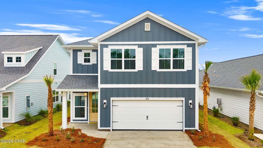 Welcome to 872 Walsonham Drive, a new home located at Breakfast Point East in Panama City Beach, Florida. This stunning home is ready for move in and has elegant interior features including 9-foot ceilings, EVP flooring on the main level, and an abundance of large windows filling the home with natural light. The primary suite is the only bedroom on the main level with the remaining four guest bedrooms and two full bathrooms located on the second floor.

As you enter the home from the covered front patio, you will pass by the stairs and powder room on your way to the heart of the home. 9-foot ceilings and sleek EVP flooring adorn the open concept living area. The family room, kitchen, and dining area flow together to make entertaining a breeze. You will find elegant quartz countertops, stainless-steel appliances, and soft close ivory painted Shaker-style cabinets in the kitchen.

Located at the back of the home is the primary suite featuring a large walk-in closet with wood shelving and en suite bathroom. Here you will find modern finishes such as the marbled tile shower with a glass door and a double vanity with quartz countertops and undermount sinks.

Heading back towards the front of the home and ascending the wood tread stairs to the second floor, you will find all four guest bedrooms with walk-in closets, a Jack-and-Jill bathroom, and an additional full bathroom.

Beyond the interior features and details, every home is equipped with Smart Home Technology.