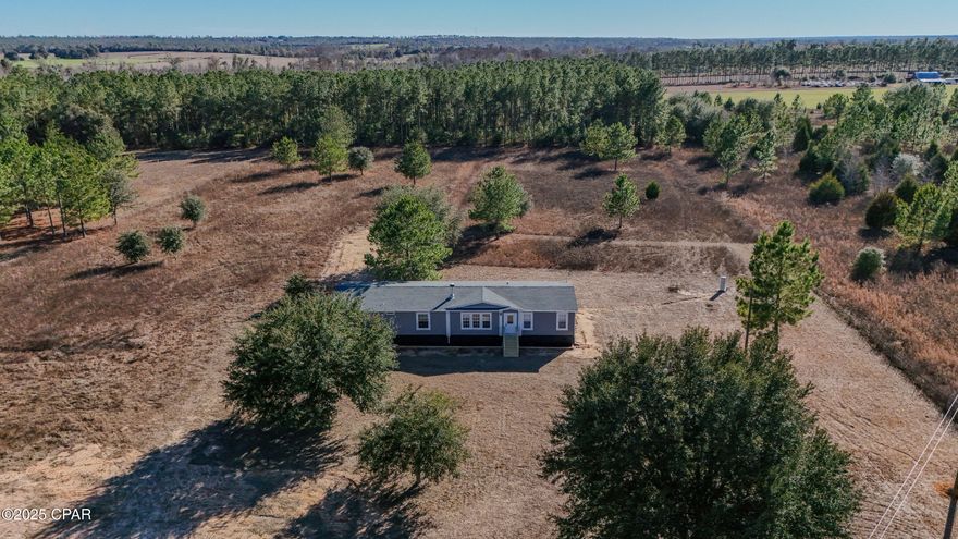 This 2021 manufactured home in the heart of Marianna, FL offers 4 bedrooms, 3 bathrooms, and 2,128 sq ft on 4.73 private acres! Enjoy an open floor plan, modern kitchen, new appliances, freshly painted, new flooring, new large deck, spacious primary suite, and plenty of room for outdoor living, animals, or hobbies. Located just minutes from Walmart, Winn-Dixie, and Florida Caverns State Park. A move-in-ready option for buyers seeking privacy with convenience. Seller financing, zero down options, lender credits are available for qualified buyers!