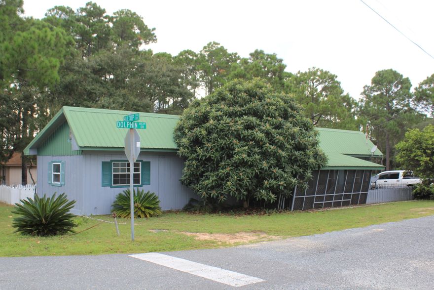 BEACH COTTAGE ONLY 2 BLOCKS FROM THE BEACH. CORNER LOT HAS AN OUT BUILDING. SOLD AS-IS.