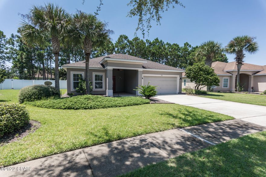 CURRENTLY UNDER CONTRACT, SELLER WILL CONSIDER BACKUP OFFERS. What a fantastic LOCATION and PERFECT home to buy!

Welcome to Palmetto Trace - one of the most desirable, family/golf cart friendly neighborhoods in Panama City Beach. This very well maintained community is only minutes away from shopping and entertainment offered by Pier Park and the sport complex at Frank Brown Park. This home is less than a mile from the sugar white beach that our area is so famous for! (accessible by the golf cart).

Updated and move-in ready 3 Bedroom, 2 bathroom, plus Bonus room home features fresh paint throughout the house, ten feet tall ceilings, new stainless steel appliances, walk-in master closet, heated/cooled garage with spray insulation throughout the attic, screened - in back porch and more! HOA takes care of 2 community pools (one of them is 30 steps away from the home!), bi-weekly trash pickup, tree-line sidewalks, underground utilities and landscaping in common areas. New Buyers Fee of .5% of the purchase price to be paid to St. Joe Community Foundation. 
All numbers (Square Footage, room sizes) are approximate, Buyers to verify if important.