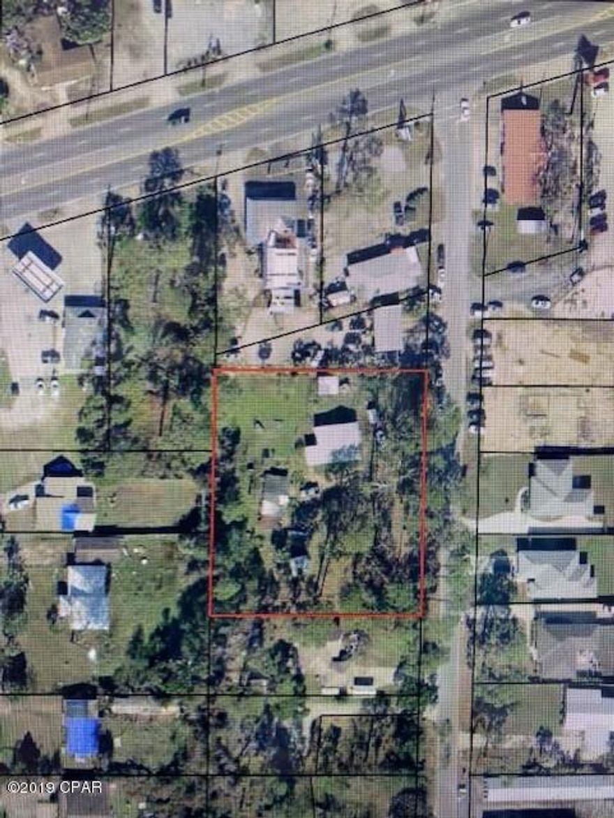 CURRENTLY UNDER CONTRACT, SELLER ACCEPTING BACKUP OFFERS' This property is completely fenced with a small beach house . The home is in livable condition and is occupied. This is a 3 bedroom 2 bath home. The value is in the land with 225' of road frontage. Great for developing. Newer construction in the area. Call today for an appt.