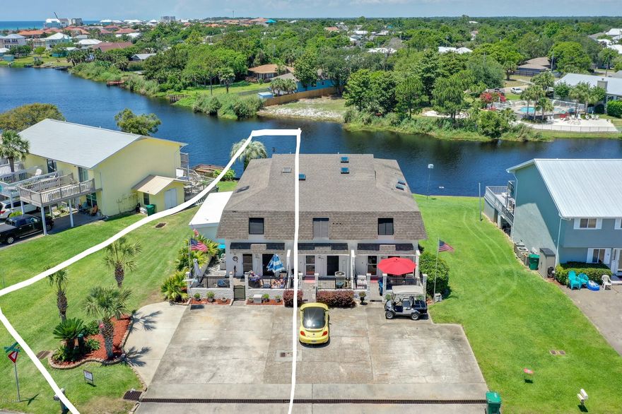 CURRENTLY UNDER CONTRACT, SELLER ACCEPTING BACKUP OFFERS. Welcome to your beautifully maintained home minutes from the Beach!  Located in the highly desirable West end of Panama City Beach.  This spacious 3 bedroom, and 3 full bath home is lakefront with a shared dock.  A short walk to the beach!  Golf Cart friendly Gulf Vista neighborhood.  Hard surface flooring throughout Main,  carpet in Master.  Screened deck has removable walls making it a year around extra TV Room with beautiful views of the lake!   Private Courtyard with gate, offers outdoor entertaining space or acts as a small fenced area for your pet.        Open master deck offers a coastal feel with peek-a-boo views of the Gulf.  Sprinkler system in place for lawn.  Large Storage shed with interior and exterior access.  No HOA Make this your permanent Beach home or your vacation Beach home.  This property offers Tons of Storage, from the extra conditioned enclosed space off the upstairs master Deck, a storage closet off the Courtyard and a large storage unit on the side of the townhouse.