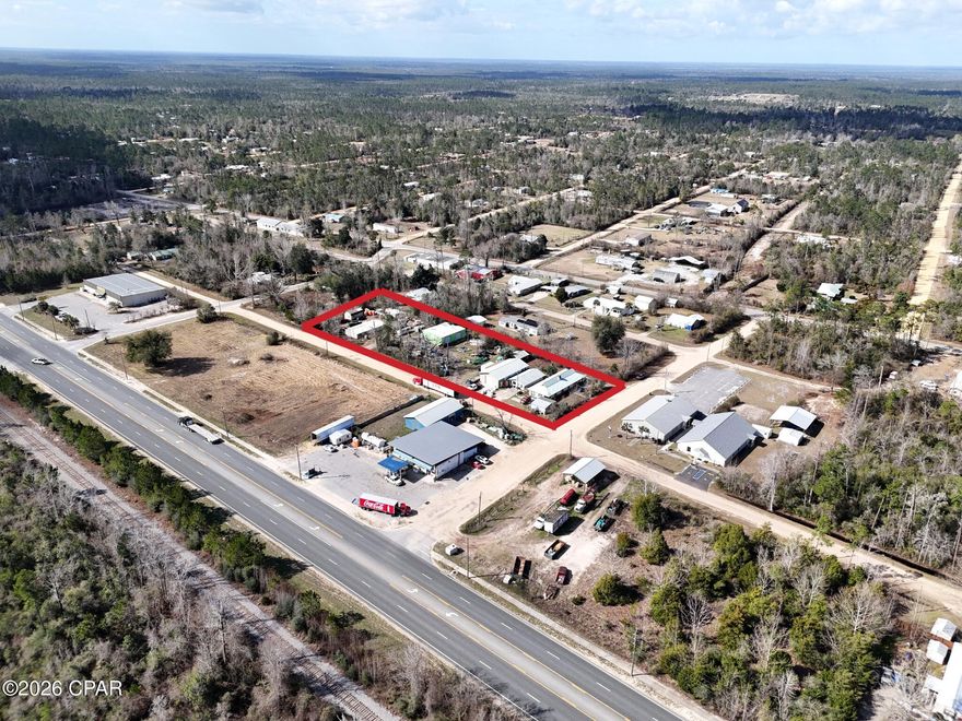 Excellent commercial opportunity for your new business headquarters including warehouse, office, and residential quarters. Situated right off Highway 231 with easy access to Panama City, Hwy 20,  and Interstate 10 corridors. Almost 1.5 acres allows for plenty of parking and outdoor storage. 

Property contains 2 main warehouses totaling 3200 sq ft, concrete floors, overhead doors and lighting. Additional storage structure of 1500 sq ft. Plenty of room for additional buildings and/or outdoor storage. 3x 4' Deep Wells provide plenty of water. All warehouses have lighting. 

Main office is updated and has room for several workstations and includes a restroom and a storage room. A detached living quarters comprised of 2 separate units, a 2 bedroom 1 Bath unit and a 1 Bedroom 1 Bath unit. Both units have kitchens. (smaller unit pictures will be updated soon). 

Comprised of 3 parcels and all have Commercial C-3 Zoning. Additional zoning information available upon request. Schedule your tour today! This property is currently occupied and all tours are to be accompanied by owner, employee, or listing agent.

Measurements, uses, and other information to be confirmed by buyer.