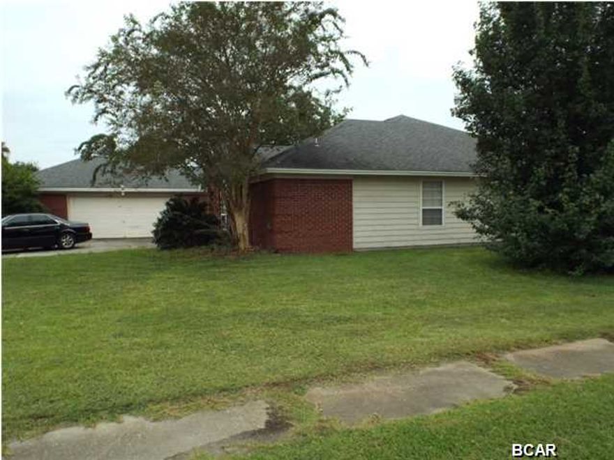 REDUCED!!!  Large brick four bedroom three bathroom house on a large lot in Callaway point offered as is. The property is close to Tyndall Air Force Base, a Super Wal Mart Shopping center, and the Bay. The property larger rooms, an oversized garage with work area, and large closets in all the bedrooms. All sizes approximate please verify accordingly.