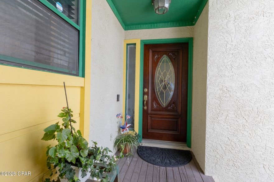 Waterfront townhouse with canal views and bay access at 1227 Capri Dr, Lynn Haven, FL. Bring your boat, kayak, or paddleboard and enjoy the peaceful coastal lifestyle with stunning sunset views. Located in Venetian Villa, this beautiful canal-front townhome offers unobstructed waterfront views and a well-designed open floor plan.

The first floor features ceramic tile, a spacious living and dining area, and an inviting kitchen equipped with a modern touchless faucet for added convenience. A stone fireplace creates a cozy atmosphere for cooler months. Step outside to the downstairs deck, perfect for relaxing or enjoying direct canal access for a small boat or jet ski. The decks were redone in 2022 with Trex Enhance decking for low maintenance and include an electric Sunsetter awning, creating a comfortable shaded outdoor space.

Upstairs you'll find 3 bedrooms and 2 baths, all carpeted, with large closets and plenty of storage space. The primary bedroom features a private balcony with ceiling fans, and a hammock that conveys with the home, making it a fun and relaxing spot to unwind and enjoy the sunshine and water views. After a fun day on the water, relax in the double jacuzzi tub.

The first floor also includes a half bath, laundry area, and access to the attached one-car garage. Centrally located in Bay County, this well-kept waterfront property offers the perfect blend of comfort, convenience, and coastal charm.