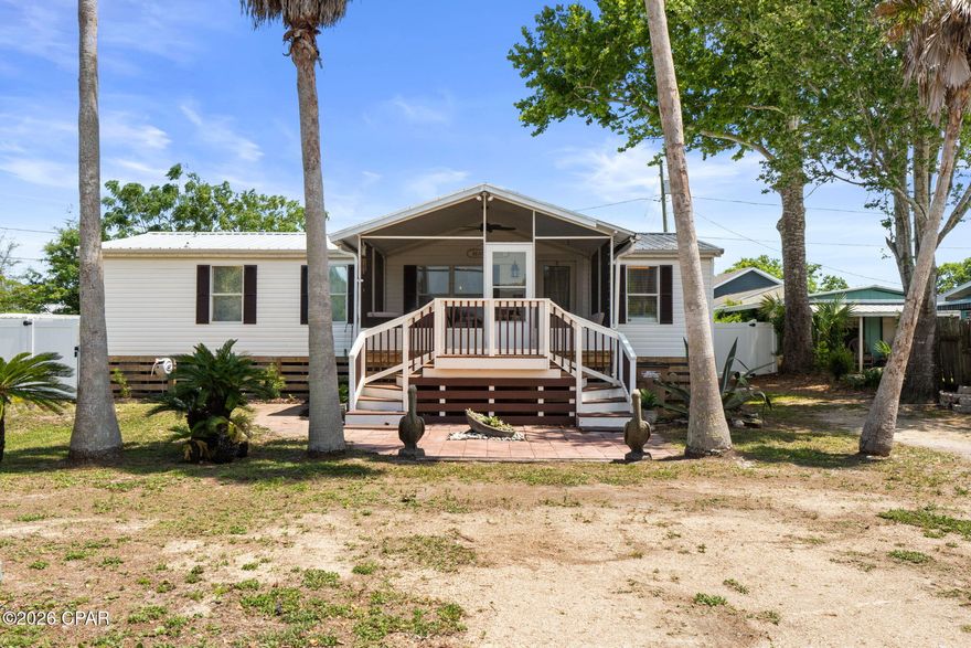 COASTAL LIVING MADE EASY! 348 Atlantic St is tucked beneath swaying palms in St. Joe Beach, Florida and offers an affordable opportunity for full-time beach living along the Forgotten Coast. This well-maintained modular home near the beach combines comfort, functionality, and a relaxed coastal lifestyle just minutes from the Gulf of Mexico. One of the standout features of this St. Joe Beach home for sale is the spacious screened-in front porch -- the perfect place to enjoy morning coffee, coastal breezes, or evenings after a day on the water. Inside, the open living, dining, and kitchen layout creates a bright and welcoming space ideal for everyday living or entertaining guests. The primary bathroom features a freestanding soaking tub, walk-in tiled shower, and custom wood accent wall for added character and comfort. Outside, the property offers a newly installed fence for added privacy along with an oversized yard that provides room for boat parking, outdoor entertaining, or storing your beach gear. A backyard storage shed offers convenient space for fishing equipment, paddleboards, golf cart accessories, and all your beach toys. Located just a short golf cart ride from the beach, this Port St. Joe property places you close to local restaurants, shopping, and the white sand beaches that make the Forgotten Coast so desirable. Whether you are searching for a beach house in Port St. Joe, a Florida Gulf Coast investment property, or an affordable coastal home for year-round living, this property checks all the boxes. Enjoy nearby kayaking, fishing, paddleboarding, scalloping, and unforgettable Gulf Coast sunsets while experiencing the laid-back lifestyle that makes St. Joe Beach so special. Call today for more information and start living the beach life!