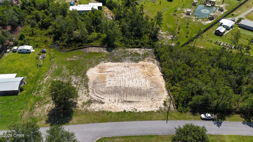 Introducing 9298 Summer Circle, a beautiful property situated in the Bear Creek area. This tranquil retreat offers a serene country neighborhood lifestyle, with convenient access to shopping, restaurants, and the 'World's Most Beautiful Beaches.' The property has been thoroughly prepared, with clearing, fill, surveying, and active permits for septic and driveway installation. It presents an exceptional opportunity to construct your dream home or place a manufactured home. Optional building plans for a 5-bedroom home are available for purchase, and manufactured home alternatives can also be provided. Schedule a visit to this property today!