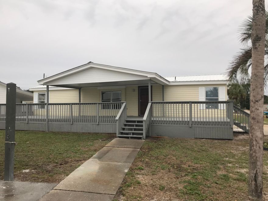 Fantastic mobile home on the west end of the beach, and just a short walk or golf cart ride to the Gulf of Mexico.  This home was recently remodeled and features vinyl wood plank floors, new paint, upgraded fixtures and counter tops.  Split bedroom floor plan with a nice size living room with kitchen/dining room combo.  This home also features a large covered porch/deck, and an over sized detached garage with storage.