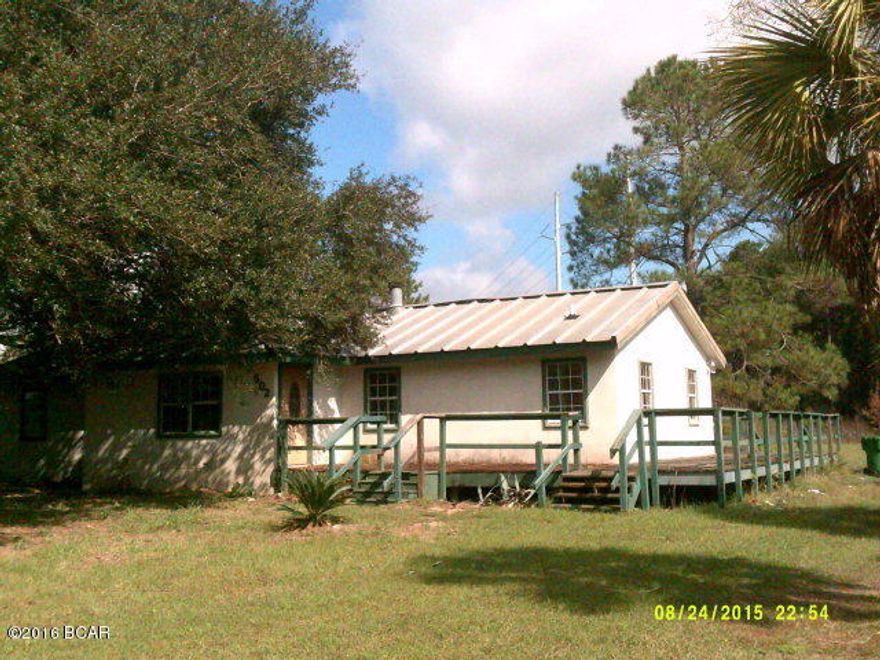 Four bedroom/2 bath home, on chain link fenced 2 acres, near beautiful Lake Susan. Home being sold AS Is, WHERE IS. Cash sale only. Restored you would have a nice home or, a great fishing retreat. Building out back would make an office or guest cottage. Property needs lots of TLC. Nice tile floors in living, dining and bath. Remainder of house needs new floor covering, electrical work and some foundation repair. Open wrap-a-round deck needs repair. Private maintained roads. Approximately 1 hr from Panama City Beach, Fl and Dothan, Al. Call today for your viewing