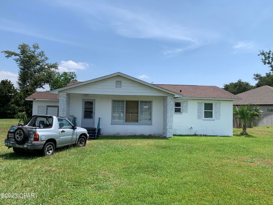 HUGE price drop!!  Wow, what a price in such a great location!!  Ranch style home in the heart of Lynn Haven.  Home is located on a large double corner lot and is just down the street from Leslie Porter Wayside Park and Sharron Sheffield Park.  Leslie Porter Wayside Park features multiple boat ramps, kids play grounds, picnic tables, sandy beach and walking bridge.  Sharon Sheffield Park also features kids play ground, amphitheater and is the home to most all the community holiday festivals for Lynn Haven.  This area is golf cart friendly and is one of the best communities in Panama City to purchase a home.  The home has an open floor plan with hardwood floors.  There is an office that could be used as a third bedroom.   Home is in need of some TLC and a new roof which reflects in the price.  This is a little jewel in a great area that has tons of potential.  Perfect for the retiree or first time home buyer!  New breaker panel just installed.