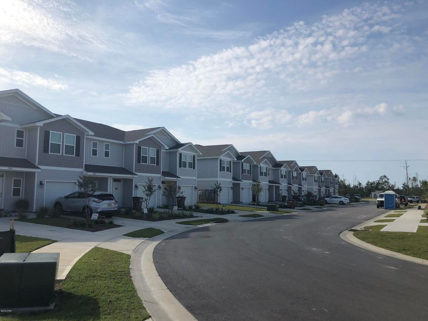 This 2 story town home at Sentinel Point  has many features including a garage, vinyl  flooring throughout the common areas, carpeting on stairs, upstairs hallway and bedrooms. Durable laminate counter tops in kitchen in baths. The kitchen is open to the living and dining area and has a breakfast bar. Frigidaire Appliances include a stove, microwave and dishwasher. Additional interior features include recessed panel cabinetry, Moen faucets, LED lighting package, smart home technology, Kwikset Smartcode lock. These townhomes have been constructed with four sided vinyl, hurricane fabric shield, weather resistant house wrap barrier, dimensional shingles, a reinforced concrete foundation