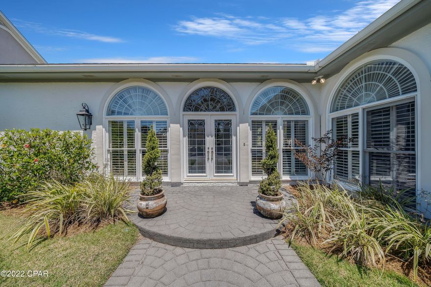 'CURRENTLY UNDER CONTRACT, SELLER ACCEPTING BACKUP OFFERS' This Canal front home is located in Bay Point, one of Panama City Beach's most sought-after communities. It is situated at the start of the canal next to the Bay Point Bridge. It features a large open floor plan that is perfect for entertaining. It has three bedrooms, each with an en-suite bathroom. Large windows are adorned with plantation shutters throughout the home. This single-level home has high ceilings, 14' in the main living area and 11' in the bedrooms, and half a dozen French doors open this home up to the pool and dock. New boat lift with 80' on deep water canal with direct access to Grand Lagoon and Gulf of Mexico just minutes away. An oversized garage, stamped concrete driveway, updated bathrooms, and well-manicured l Bay Point is a gated community with 24-hour roving security, a golf course, a new marina, a tennis club, and a LIFESTYLE.