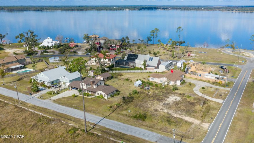 'CURRENTLY UNDER CONTRACT, SELLER ACCEPTING BACKUP OFFERS' Awesome Florida cottage in College Point, only a 30 second walk to North Bay that leads to the Gulf. This 3/2 move-in ready Lynn Haven home with nearly 1800 sq ft is close to the Bailey Bridge and the park offering a public boat ramp, shorefront and more! The solid concrete block home has been totally renovated complete with a new roof, new AC duct work, flooring, bathrooms, paint and an awesome kitchen with backsplash and new stainless appliances. Tons of open living spaces including an enclosed Florida room plus a large open back patio with composite decking for longevity. The updates place this home with an effective year of 1990+ on a .59 acre parcel. Quiet neighborhood on a street that ends at Issac Byrd Park right on the ba