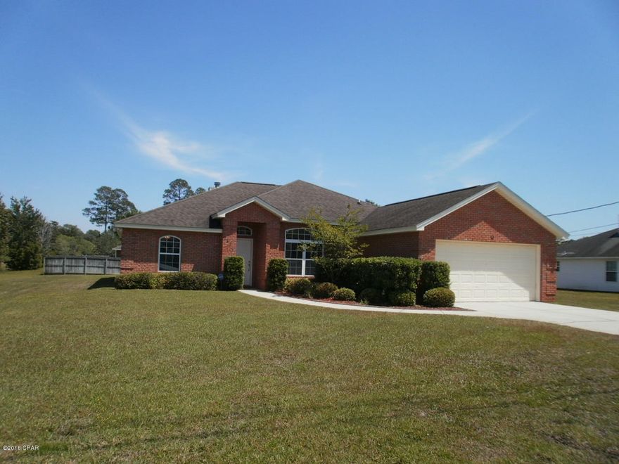 You might just think this home is perfect:  great location - not five minutes to Starbucks, grocery stores, restaurants, shopping, churches and medical facilities; nice-sized, partially fenced lot to enjoy those cook-outs under the covered backyard patio; desirable, newly painted, split bedroom floor plan - open and airy with tons of natural light from the many windows and their transcoms.  Living room features crown molding and fireplace.  Home offers a formal dining room, eat in kitchen area with bay window, and 7' breakfast bar, 3 bedrooms and 2 full bathrooms, and a separate 10' x 6' laundry room. The master bedroom is spacious with a double vanity in its adjoining bathroom, garden tub, separate shower, water closet, and large, walk in closet. Tile in kitchen, baths, laundry, foyer, and hall.  Come look quick before this home is gone!