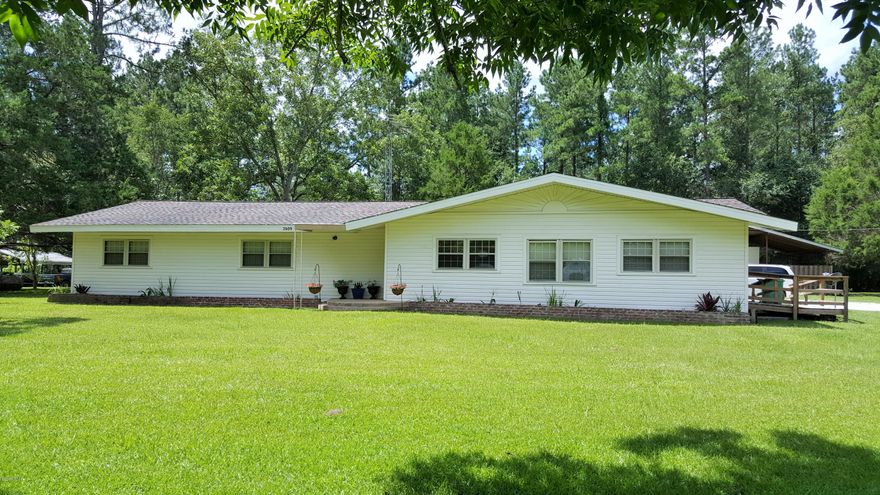 SELLER TO PAY UPTO $5,000 TOWARDS BUYERS CLOSING COST!!! Very nice 4 bedroom, two and a half bath home located in the heart of Cottondale and in a great little neighborhood.  Home is on a very nice 1.37+/- lot.  City water and sewer.  Tongue and grove pine walls thru-out home, two central ac/heat units, one bedroom has it's own private entrance with a wheelchair ramp and a 21 x 39 attached carport or covered back patio.  There is also a very nice pole barn out back with a secured storage building in the middle and open storage on each side.  Home does need a little TLC but is priced to sell at just a tad over $47.00 per heated and cooled sq ft.  Make your appointment today.  (Renters are moving out and I will have better pictures to follow this week)